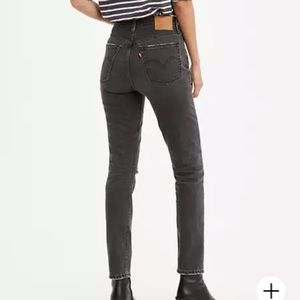 Levi’s 501 skinny black ripped denim jeans